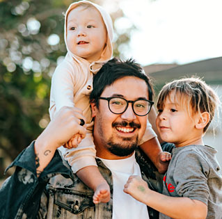 photo of a young man with his two children